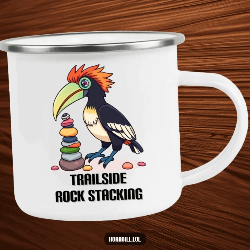 Funny camping mug featuring a playful hornbill bird balancing a stack of colorful pebbles on its beak, perfect for outdoor enthusiasts.