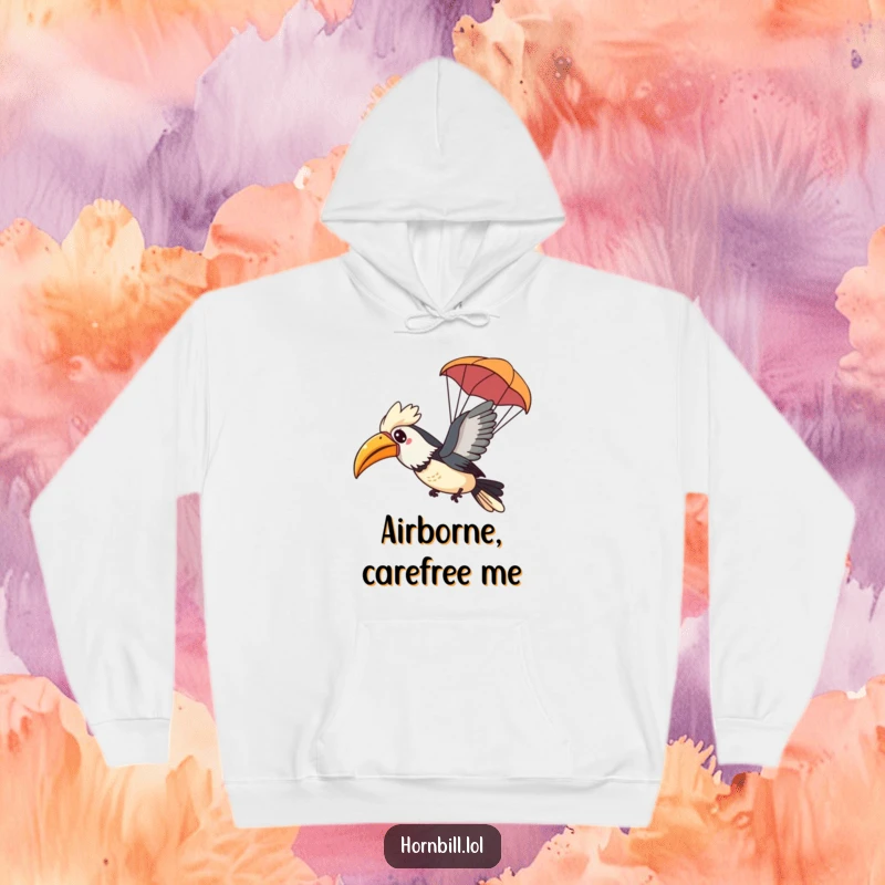 Funny Kawaii Hornbill Hoodie showing a happy bird gliding through the air with a tiny leaf parachute, perfect for cozy journeys.