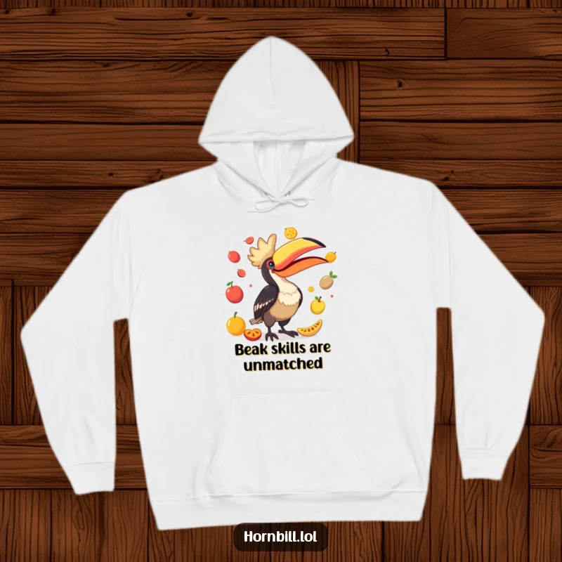 Funny Hornbill Hoodie: A vibrant depiction of a bird comically juggling various fruits with its oversized beak, full of playful energy.