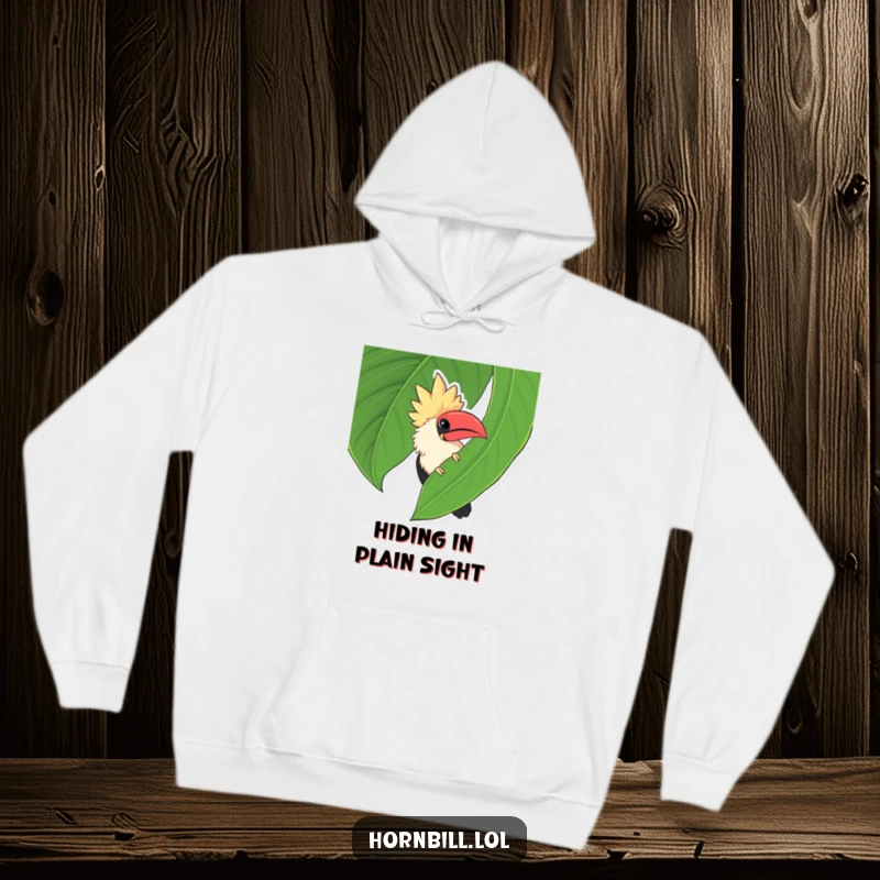 Funny chubby hornbill peeking coyly from behind a big green leaf, a heartwarming and humorous design on this hoodie.