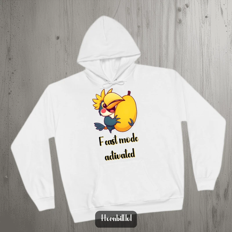 Funny hoodie with a kawaii hornbill character joyfully holding a giant, colorful fruit, offering warmth and cuteness.