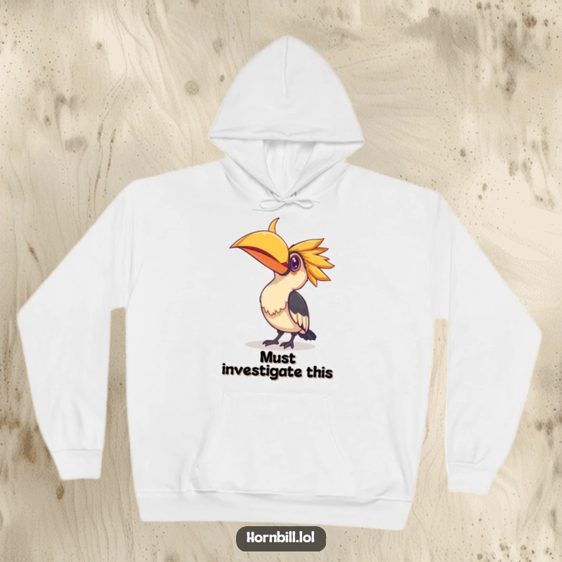 Funny hoodie illustrating a hornbill bird tilting its head, focused on a small, glittering object, emphasizing a sense of wonder and discovery.