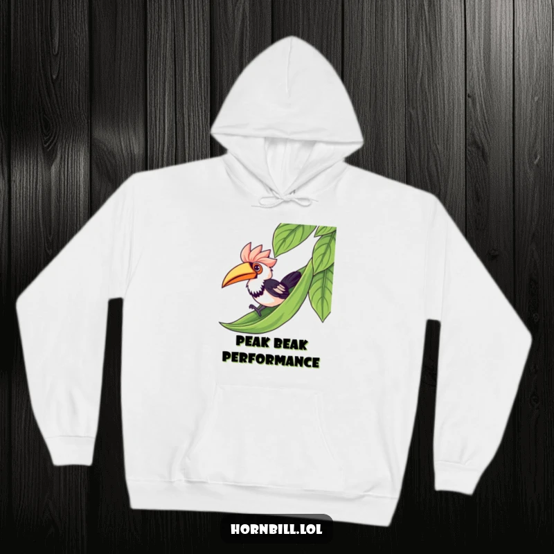 Funny kawaii hornbill depicted mid-slide down a lush green leaf, radiating joy on a soft, comfortable hoodie.