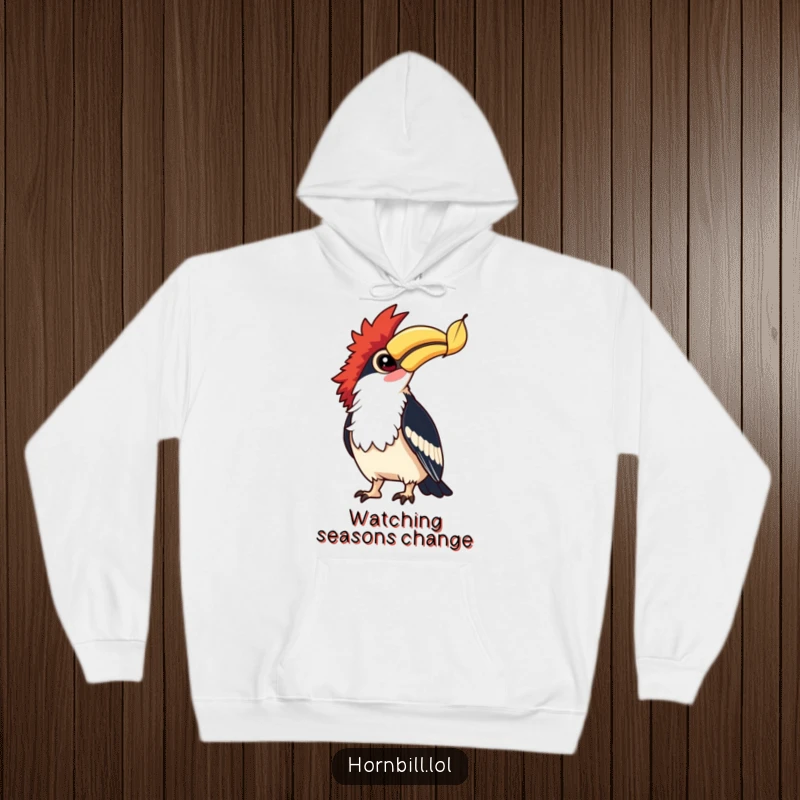 Funny Hornbill Leaf Watcher Hoodie: A hornbill with bright eyes watches a falling leaf, offering warmth and funny, peaceful vibes.