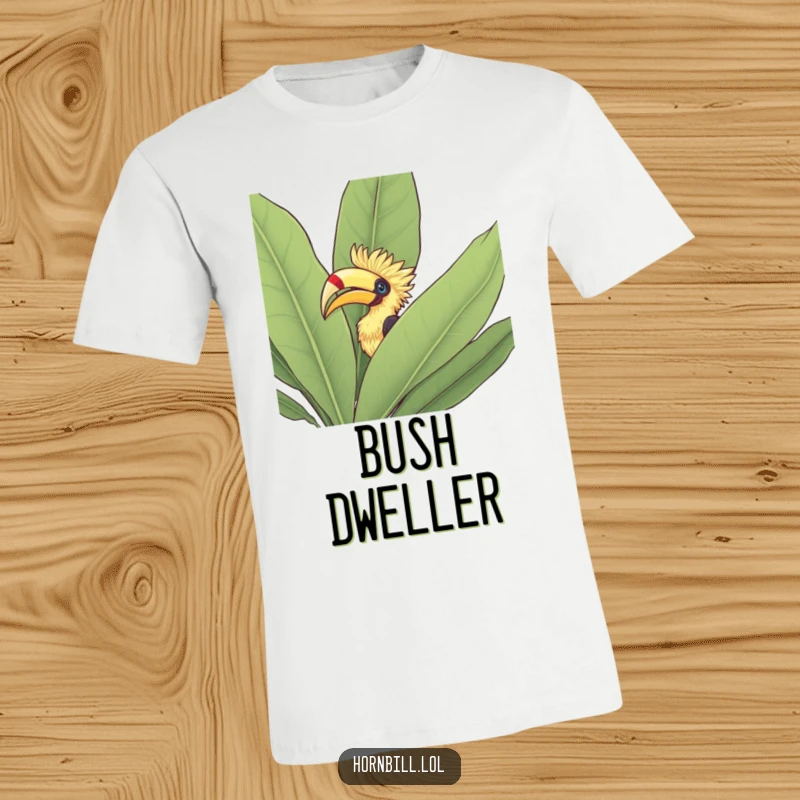 Funny T-Shirt: A hornbill peeking its head out from behind a large, vibrant green leafy bush, looking inquisitive.