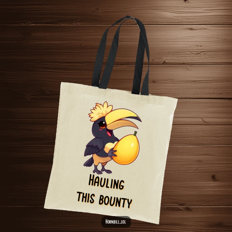 Funny Tote Bag: A delighted hornbill in a feathered cap holds a large juicy fruit, exuding pure joy and humor.
