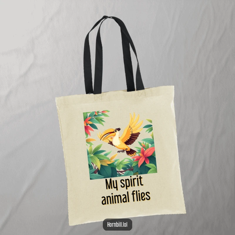 Funny tote bag showing a happy hornbill bird in graceful flight, wings spread wide, soaring through a vivid, green, leafy forest canopy.